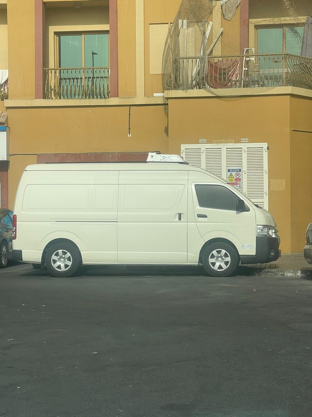 Insulated interior of a refrigerated van with checker-plate flooring in Dubai